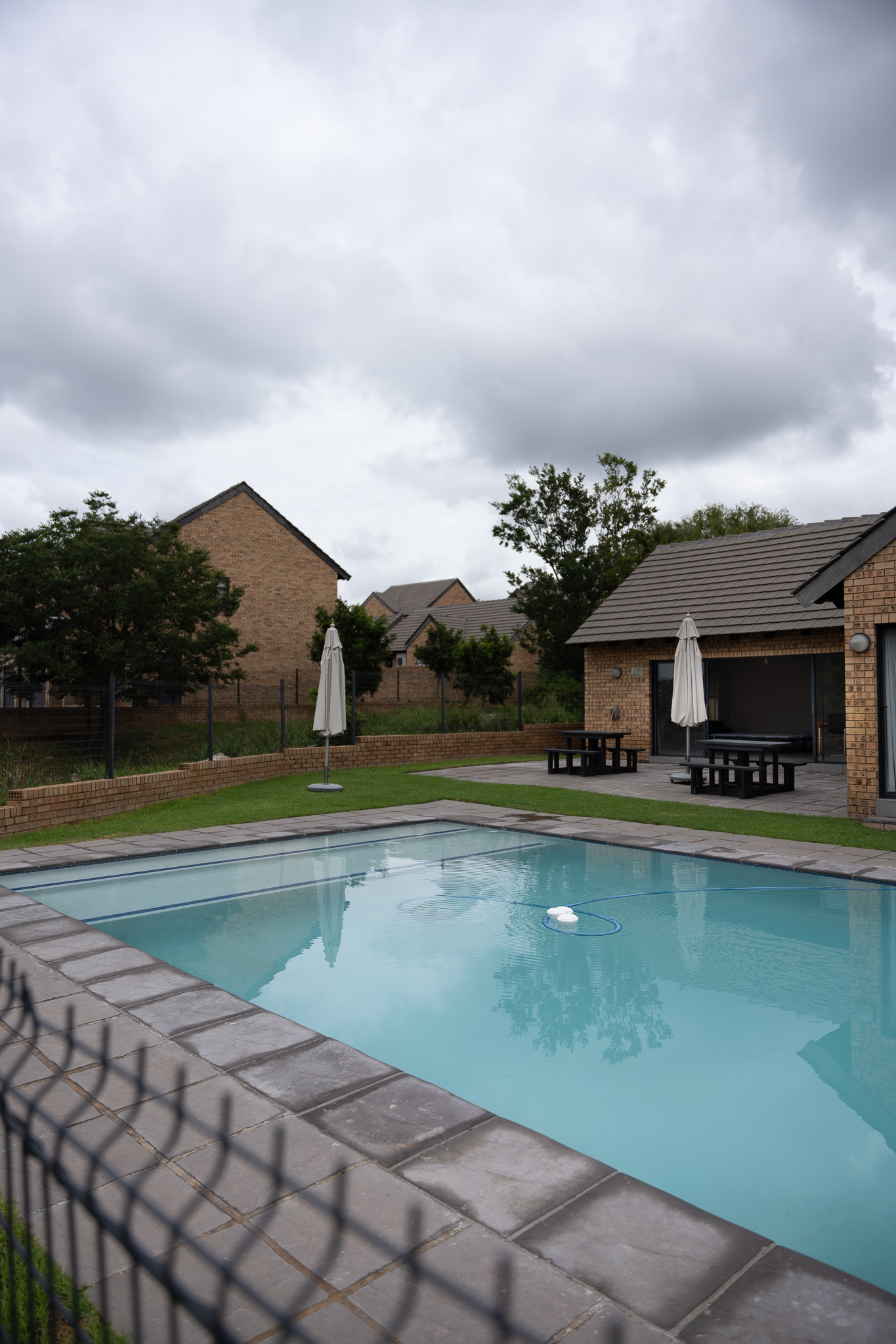 DSC03766 Outside view of Kyalami Creek Luxury Apartments showing pool area as well as solar panels that provide backup electricity.